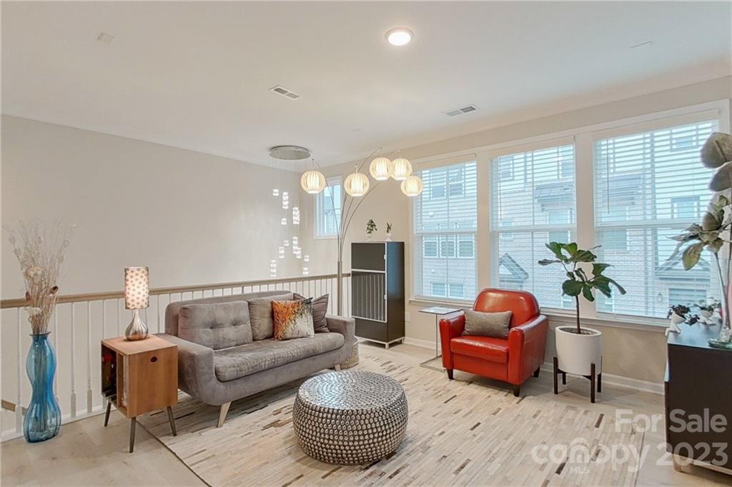 511 Upper Stone Circle Charlotte, NC 28211 - Photo 13 of 32 a living room with furniture and a large window