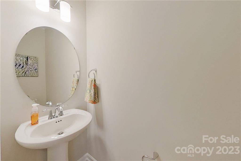 511 Upper Stone Circle Charlotte, NC 28211 - Photo 19 of 32 a bathroom with a sink and a mirror