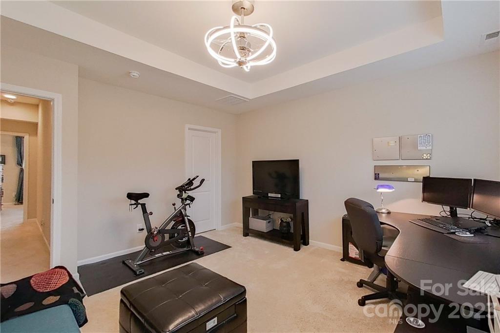511 Upper Stone Circle Charlotte, NC 28211 - Photo 25 of 32 a view of a workspace with furniture and a window