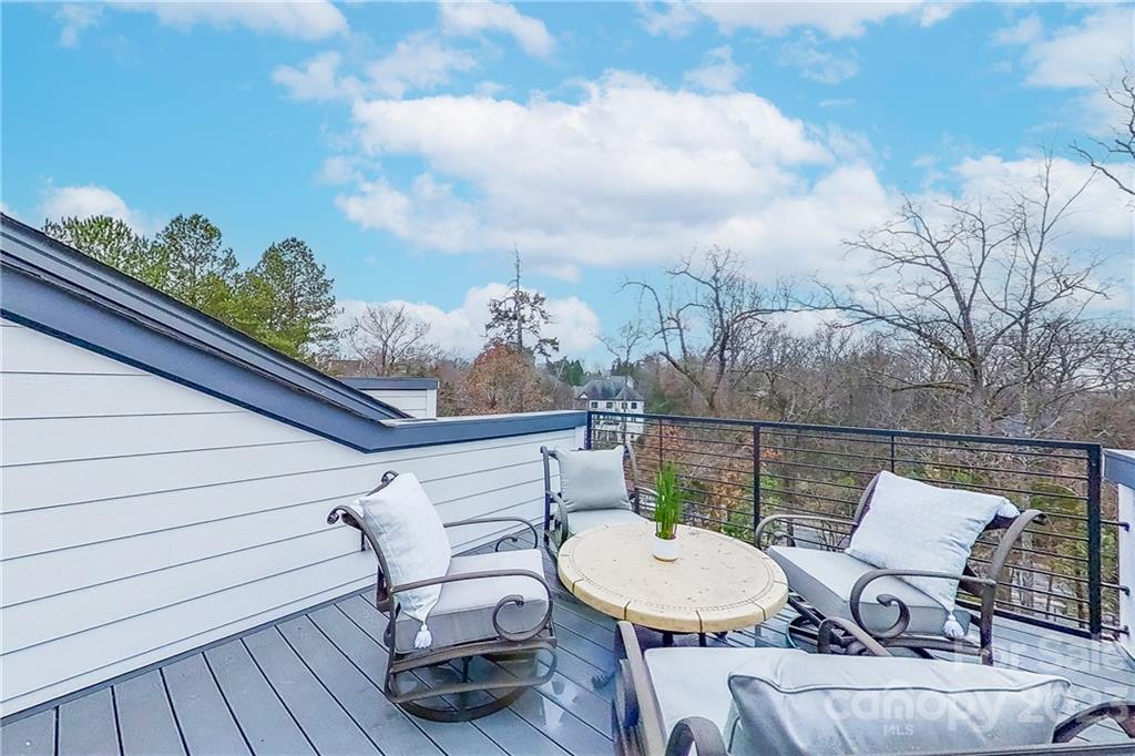 511 Upper Stone Circle Charlotte, NC 28211 - Photo 6 of 32 a view of a patio with a table chairs and a potted plant