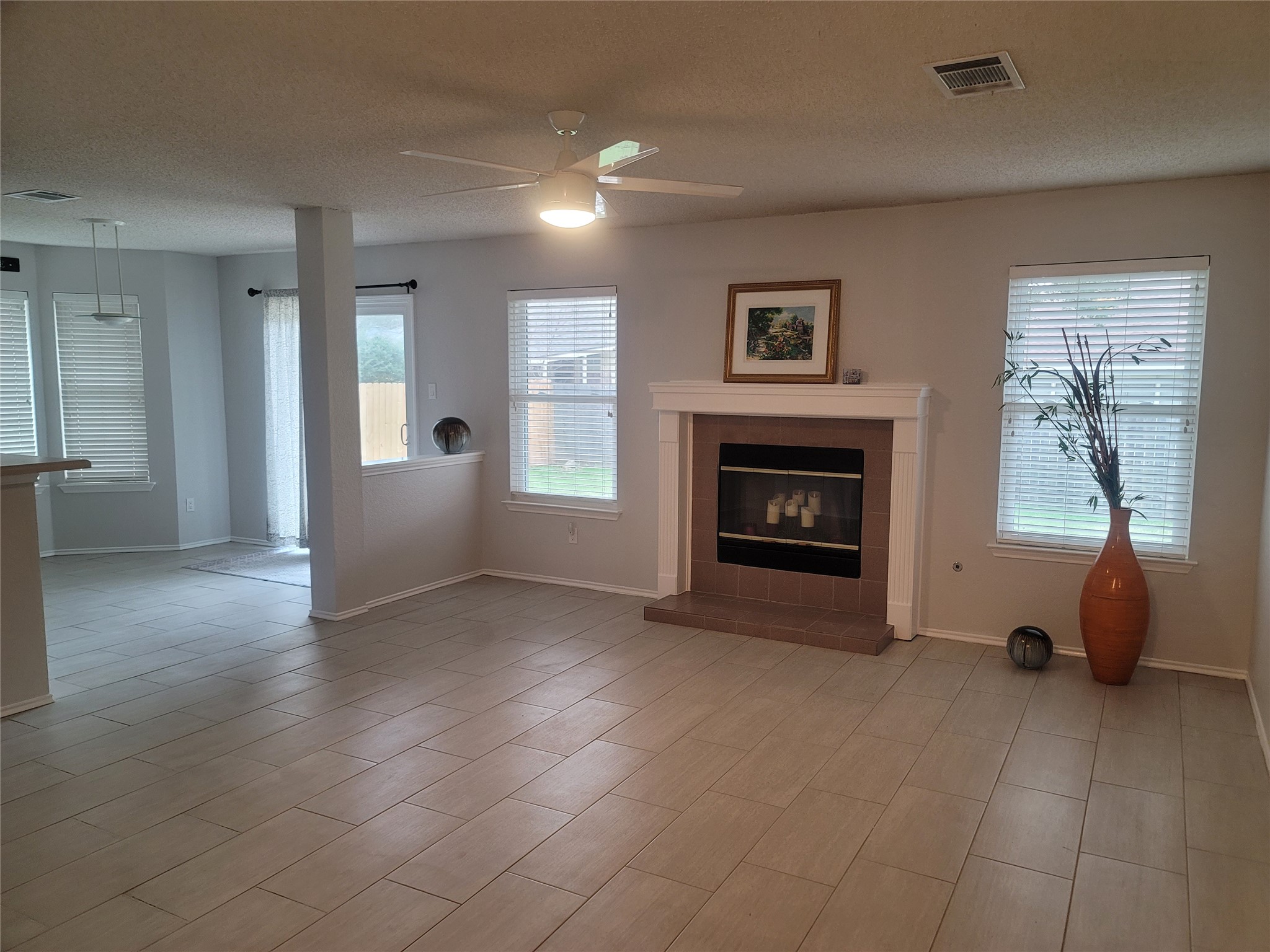 1805 Timber Ridge Drive Cedar Park, TX 78613 - Photo 2 of 21 a view of an empty room with furniture and a fireplace