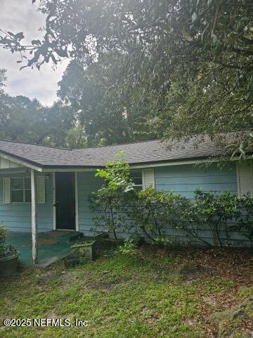 6526 Ribault Road Jacksonville, FL 32209 - Photo 2 of 13 front view of a house with a yard