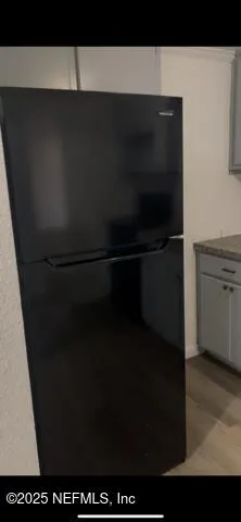 a bathroom with a black white checkered floor and a sink
