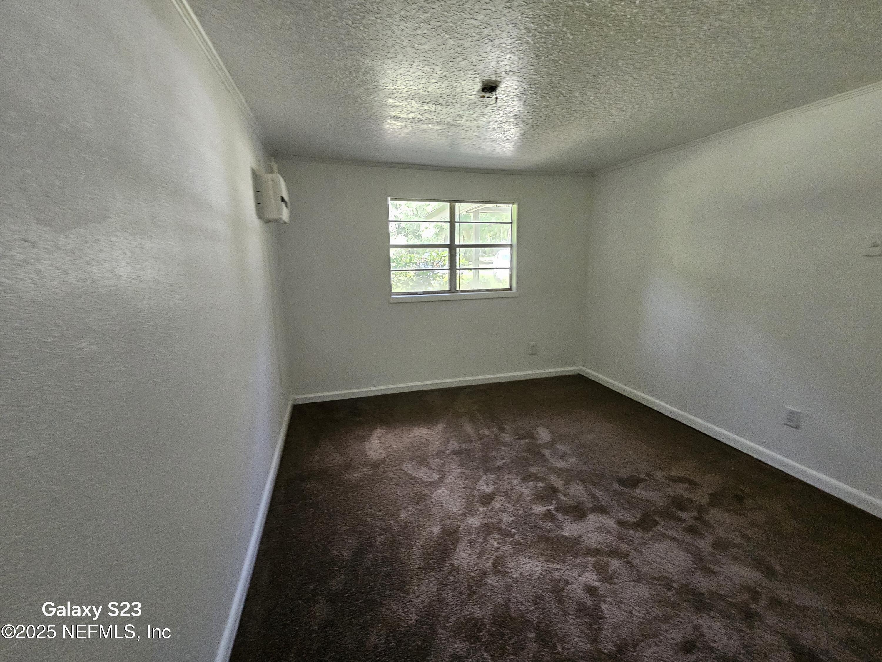 6526 Ribault Road Jacksonville, FL 32209 - Photo 8 of 13 an empty room with a window