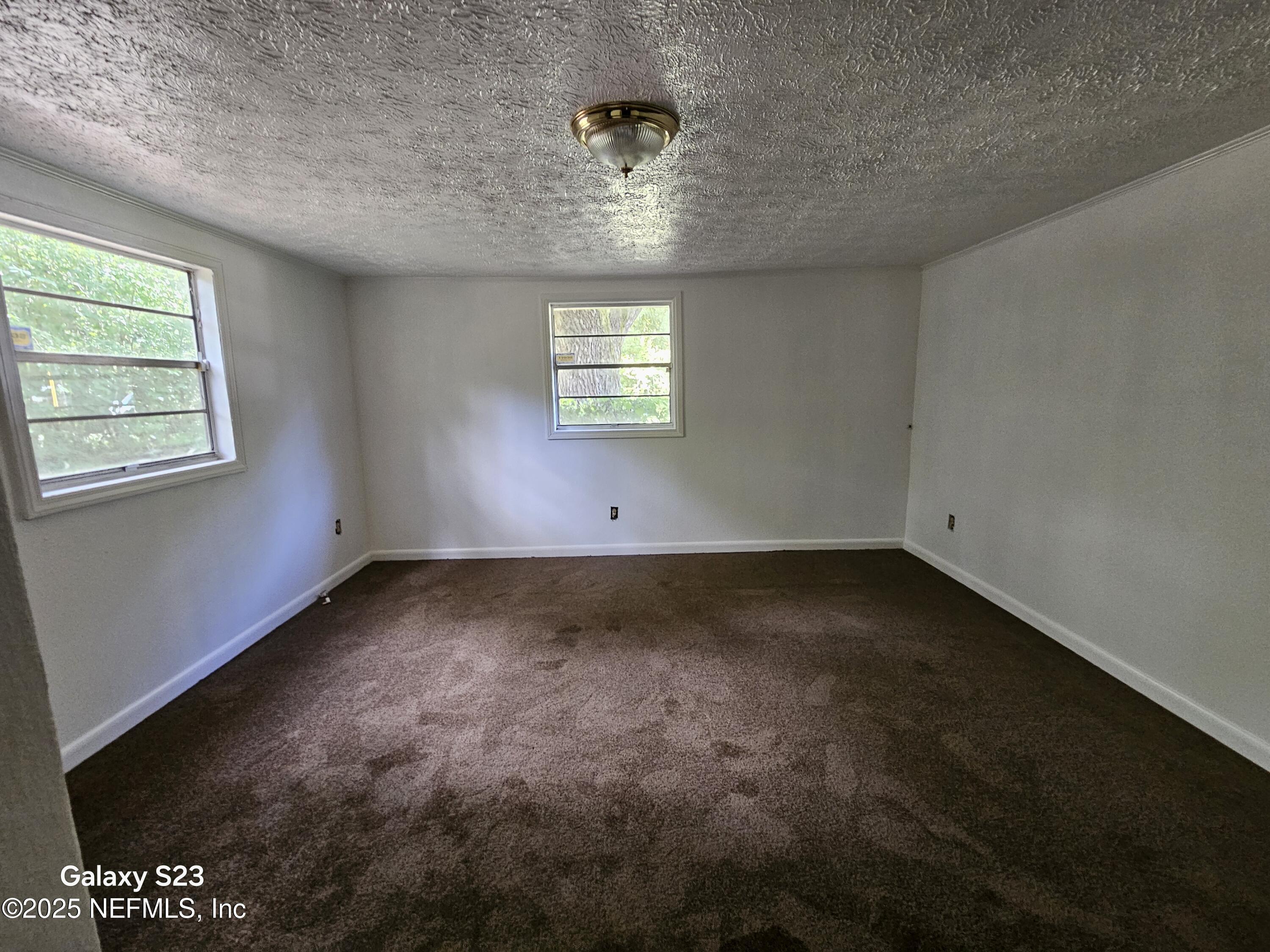6526 Ribault Road Jacksonville, FL 32209 - Photo 9 of 13 an empty room with a window