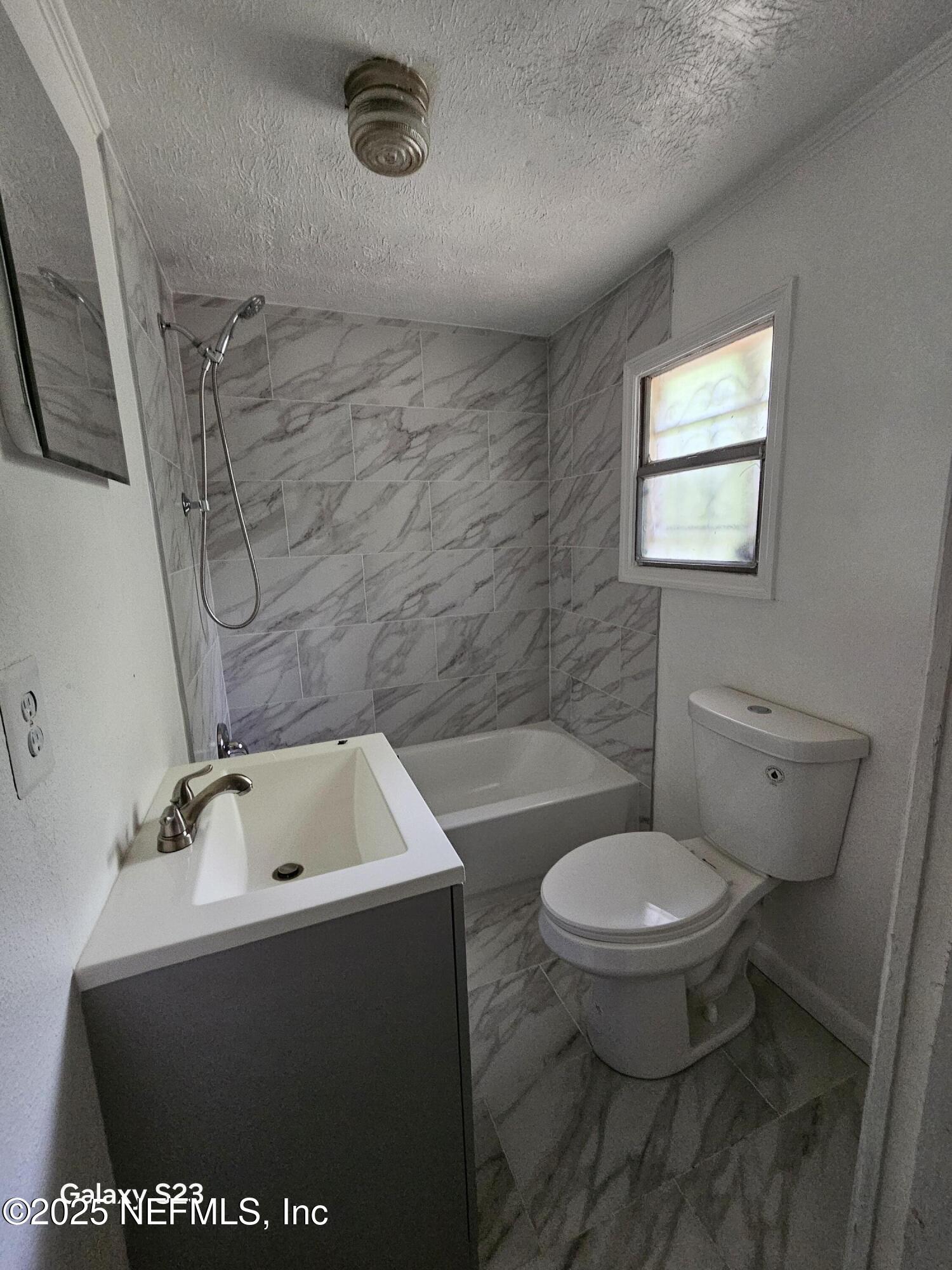 6526 Ribault Road Jacksonville, FL 32209 - Photo 10 of 13 a bathroom with a sink and a toilet