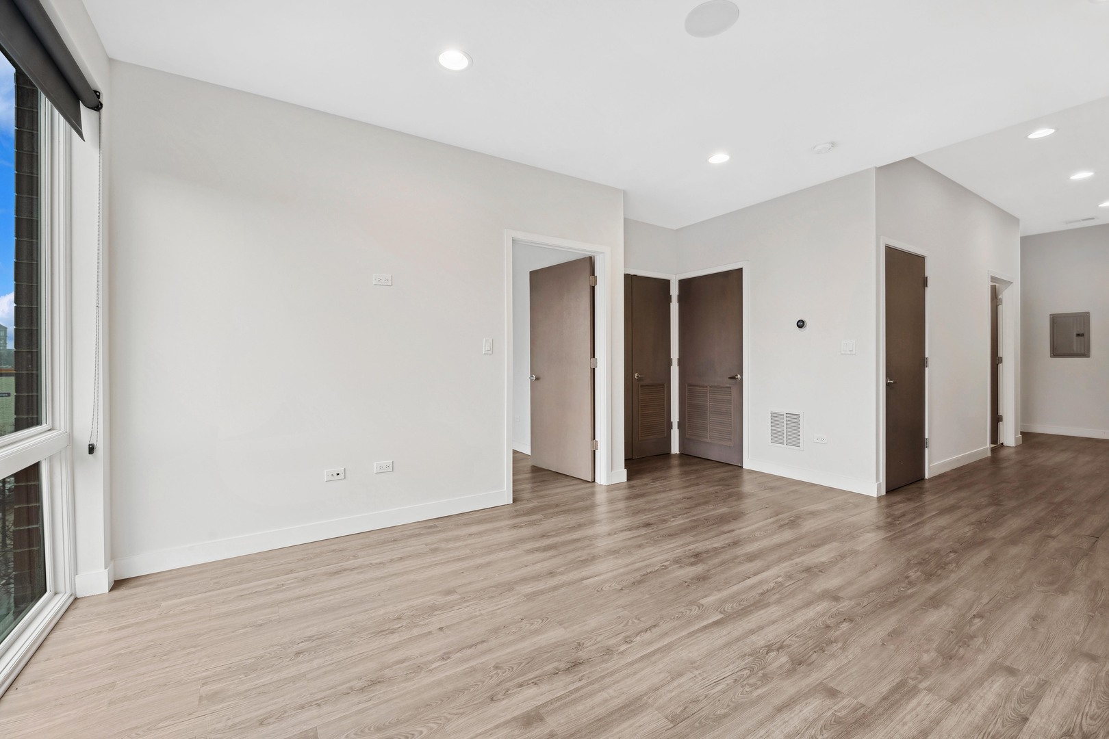 4027 North Broadway, Unit 501 Chicago, IL 60613 - Photo 4 of 14 a view of an empty room with wooden floor