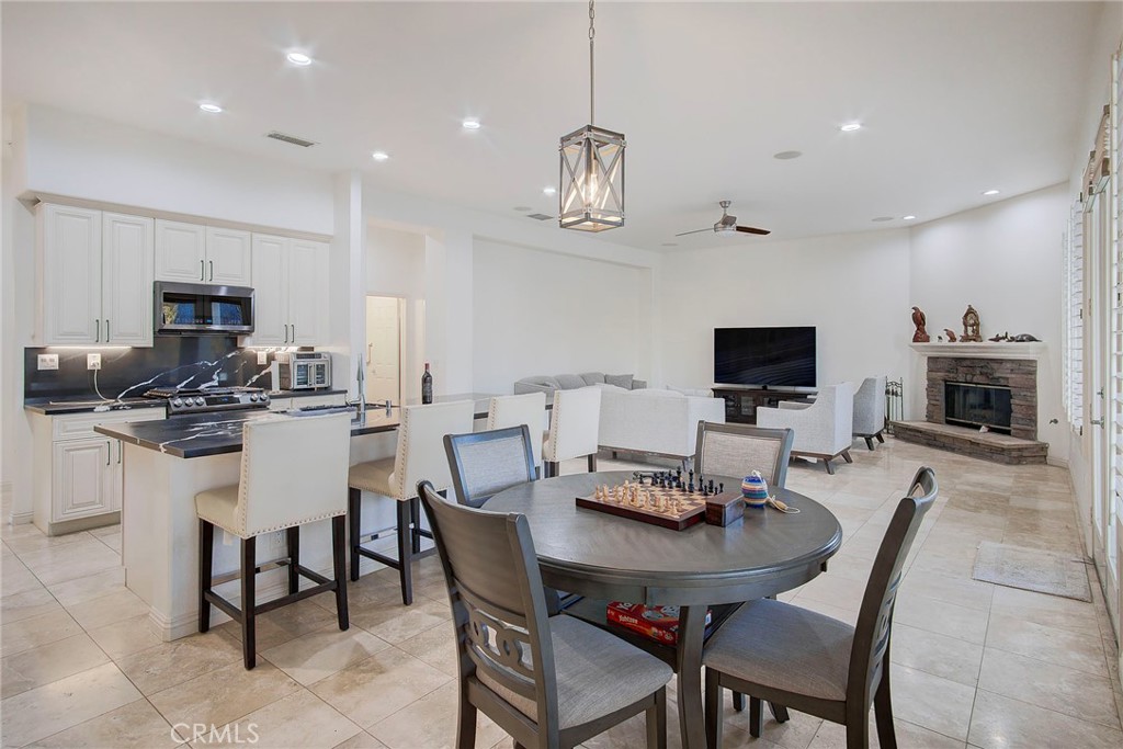 18120 Gentian Avenue Riverside, CA 92508 - Photo 27 of 51 a view of a dining room with furniture