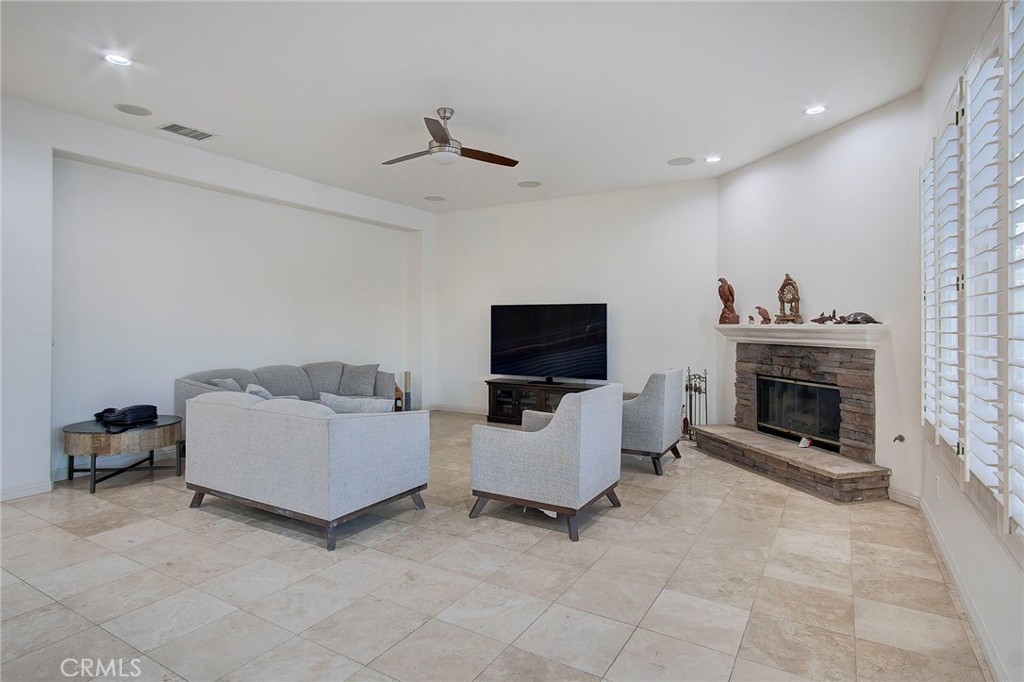 18120 Gentian Avenue Riverside, CA 92508 - Photo 28 of 51 a living room with furniture and a fireplace