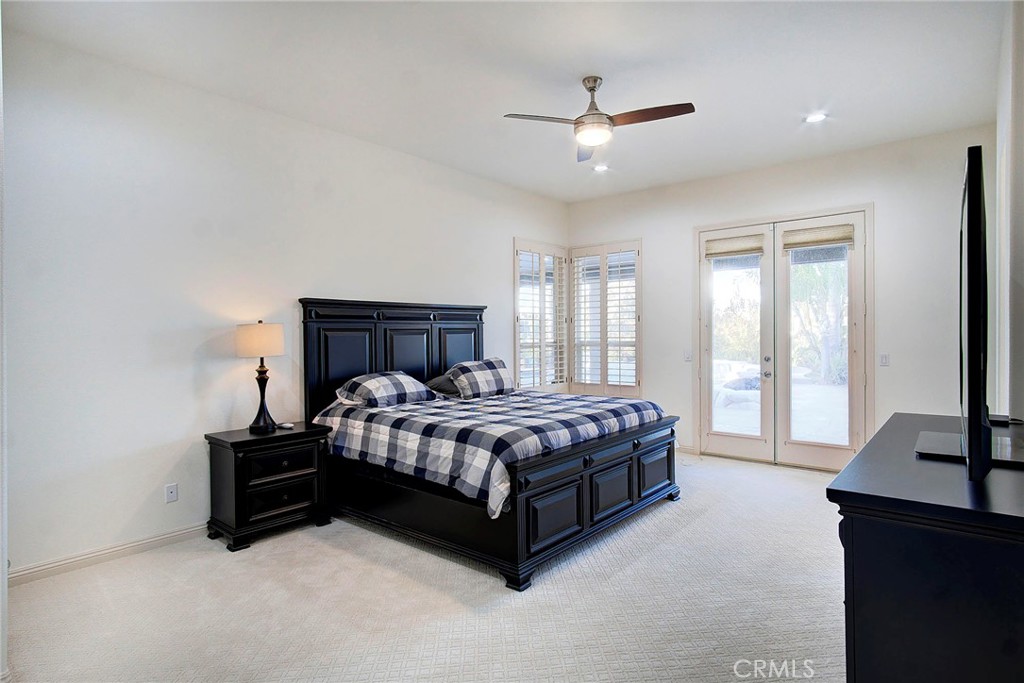 18120 Gentian Avenue Riverside, CA 92508 - Photo 33 of 51 a bedroom with a bed lamp and a large window