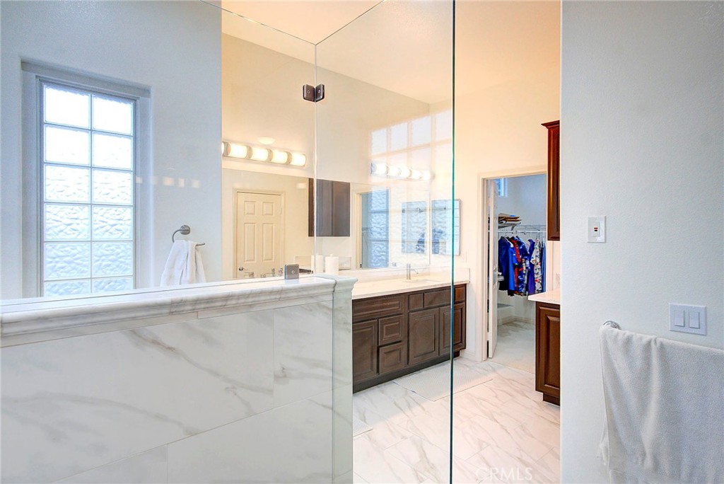 18120 Gentian Avenue Riverside, CA 92508 - Photo 36 of 51 a large white kitchen with a large window