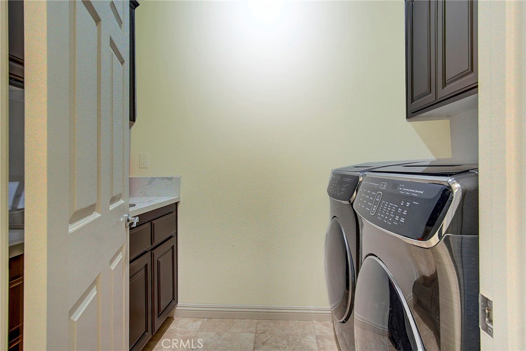 18120 Gentian Avenue Riverside, CA 92508 - Photo 41 of 51 a utility room with dryer and washer
