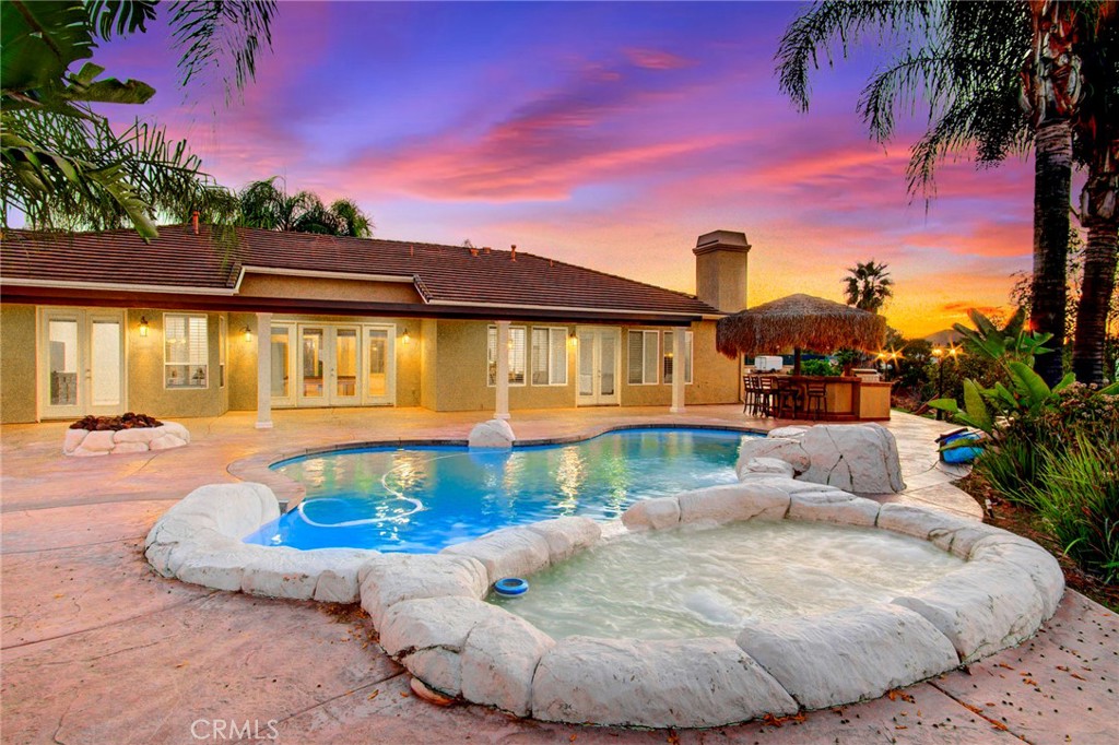18120 Gentian Avenue Riverside, CA 92508 - Photo 45 of 51 a view of a swimming pool with an outdoor seating