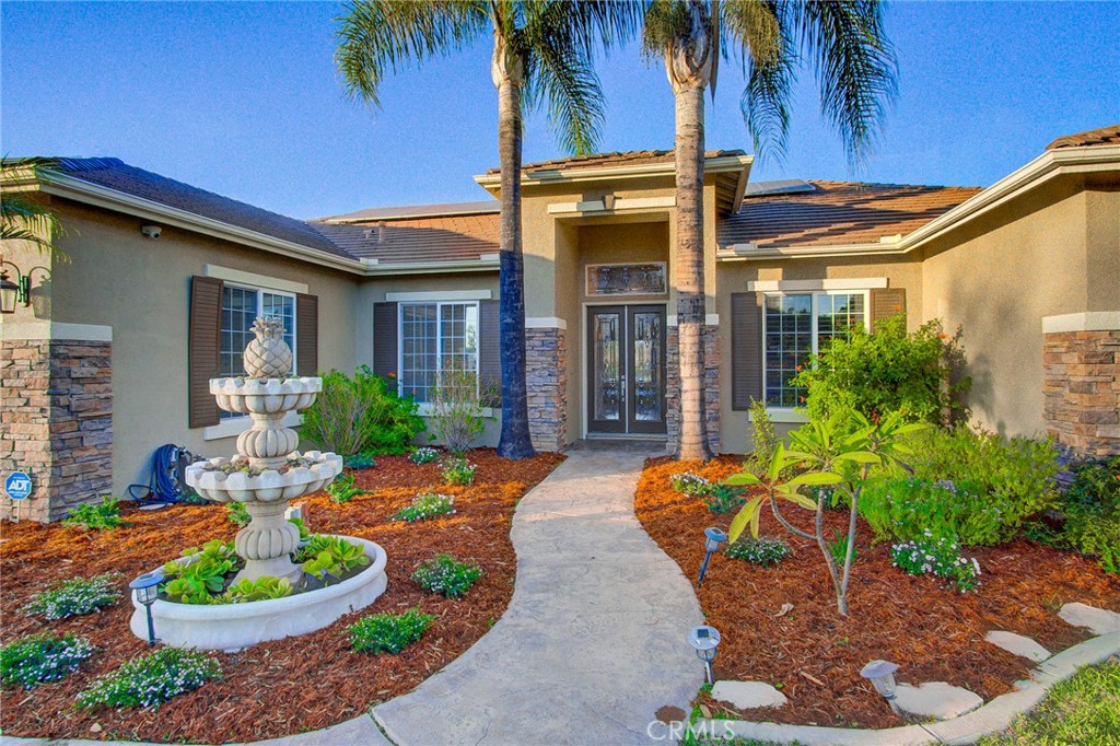 18120 Gentian Avenue Riverside, CA 92508 - Photo 8 of 51 a front view of a house with a yard