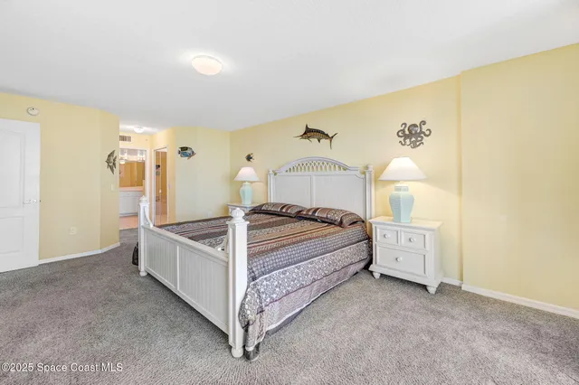 a bed room with a bed and a night stand