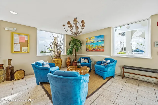 a reading room with furniture and window