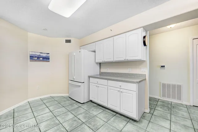 a kitchen with a cabinets and a stove top oven