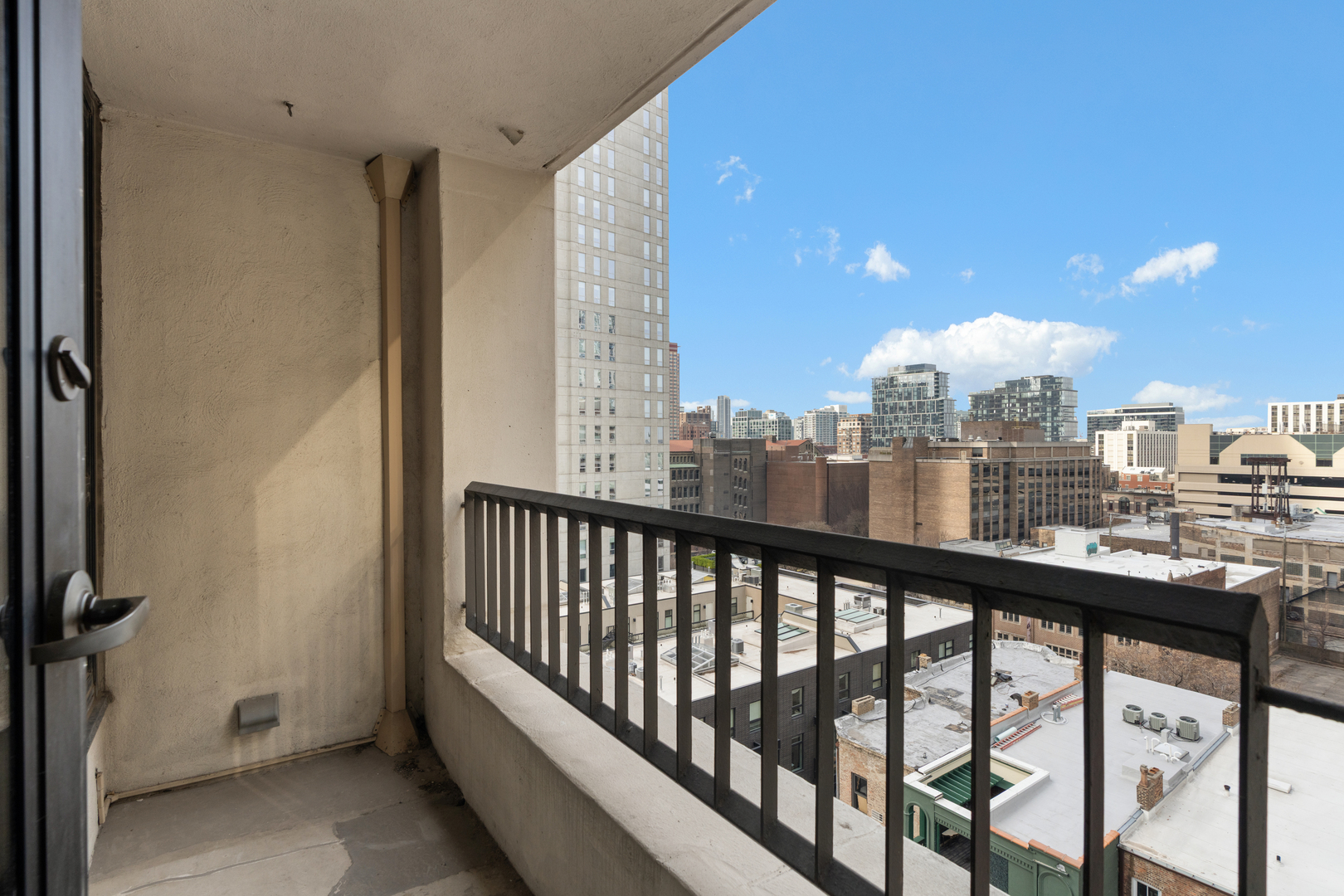1030 North State Street, Unit 5M Chicago, IL 60610 - Photo 11 of 14 a view of a city from a balcony