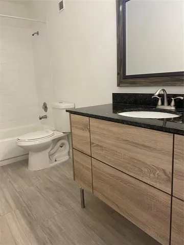 a bathroom with a sink and a toilet