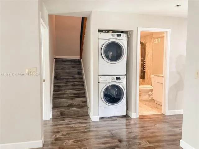 a view of a hallway with washer and dryer