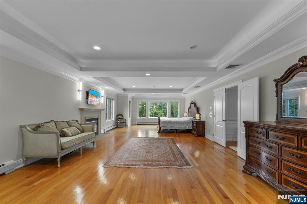 1 Euclid Road Fort Lee, NJ 07024 - Photo 24 of 50 a living room with furniture and a wooden floor