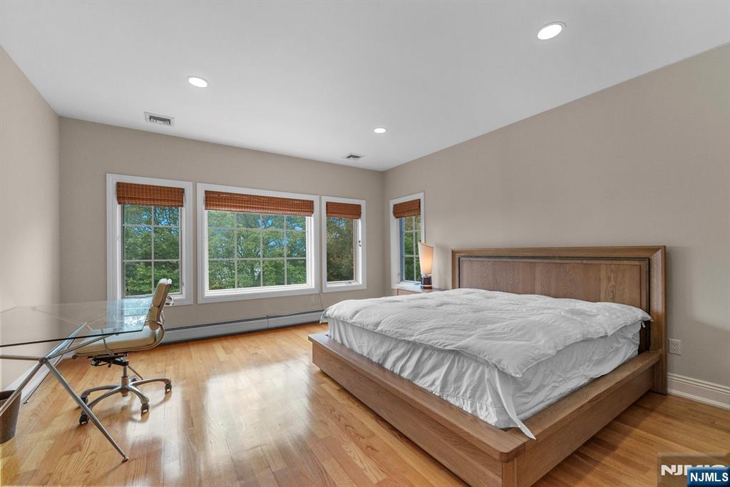 1 Euclid Road Fort Lee, NJ 07024 - Photo 28 of 50 a bedroom with a large bed and large windows