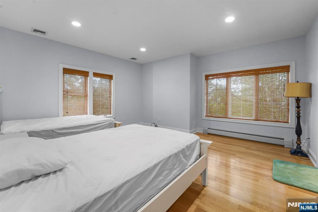 1 Euclid Road Fort Lee, NJ 07024 - Photo 29 of 50 a bedroom with a bed and a window