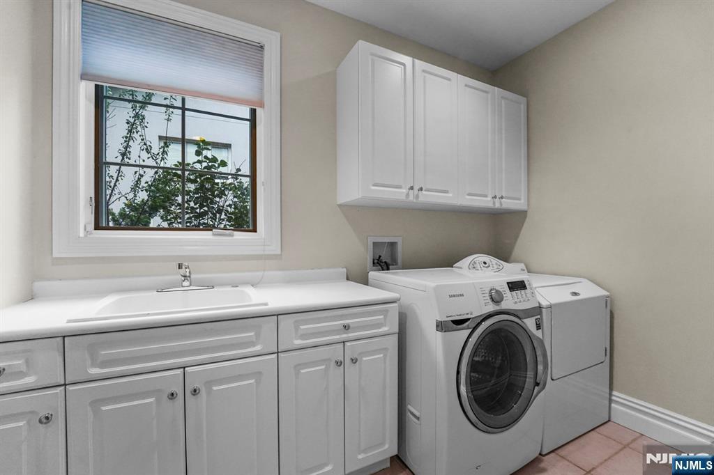 1 Euclid Road Fort Lee, NJ 07024 - Photo 44 of 50 a utility room with sink dryer and washer