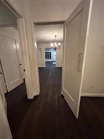 a view of a room with wooden floor and staircase