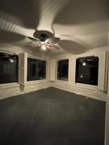 a view of an empty room with a fireplace