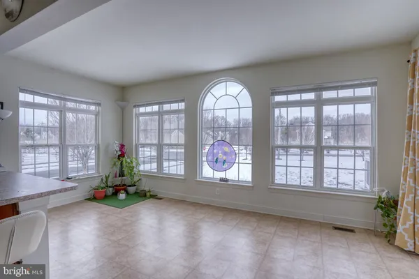 a living room with furniture and windows