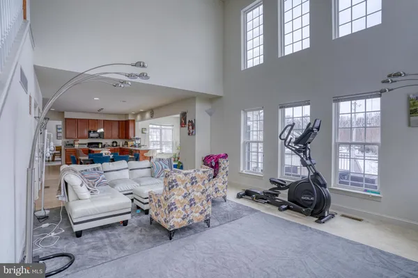 a living room with furniture and white walls