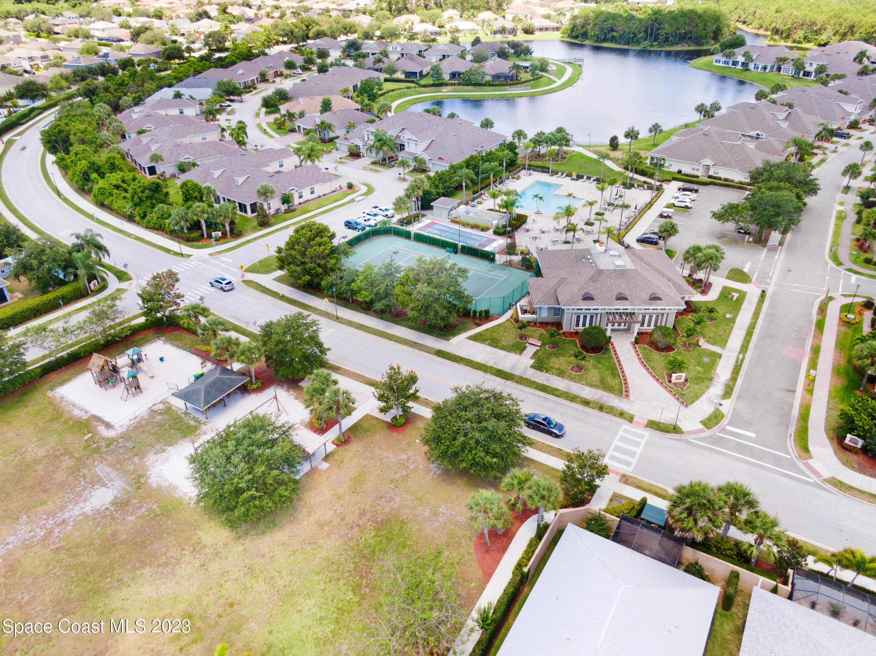 1202 Becket Place Melbourne, FL 32940 - Photo 61 of 69 an aerial view of a house with a lake view