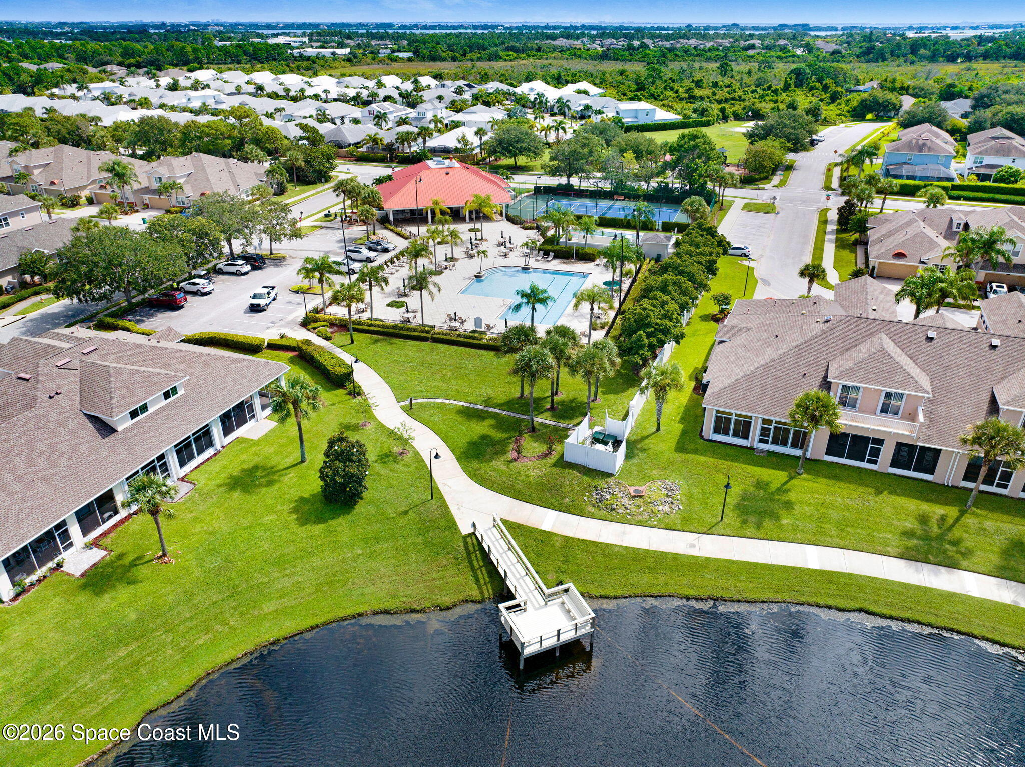 1202 Becket Place Melbourne, FL 32940 - Photo 68 of 69 an aerial view of a house with a swimming pool