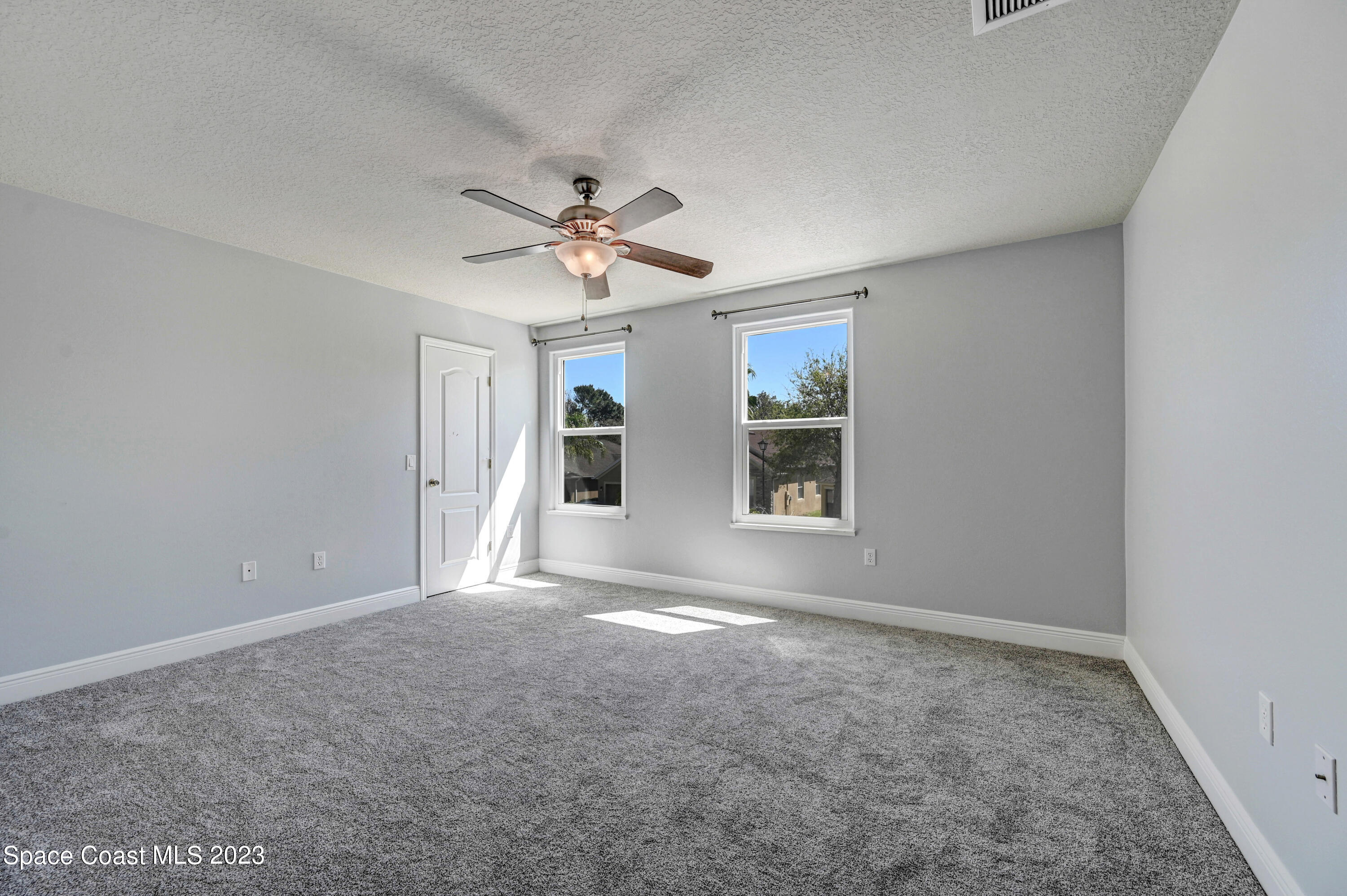 1202 Becket Place Melbourne, FL 32940 - Photo 10 of 69 a view of an empty room with a window