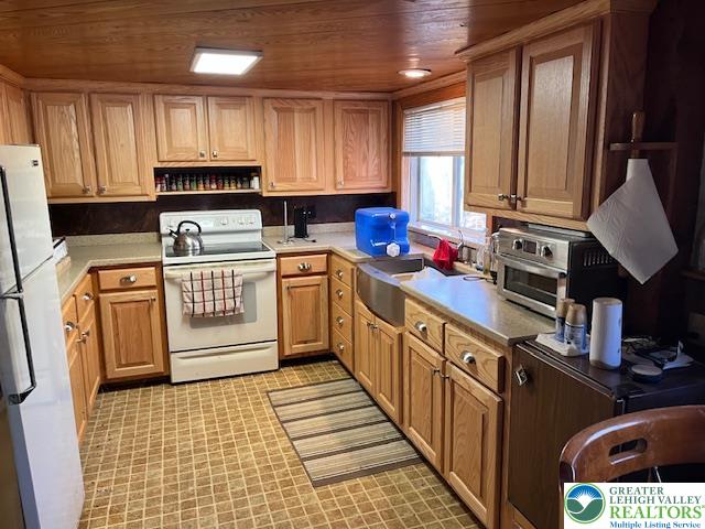 119 Little Mud Pond Road Dingmans Ferry, PA 18328 - Photo 4 of 23 a kitchen with stainless steel appliances a stove sink refrigerator and cabinets