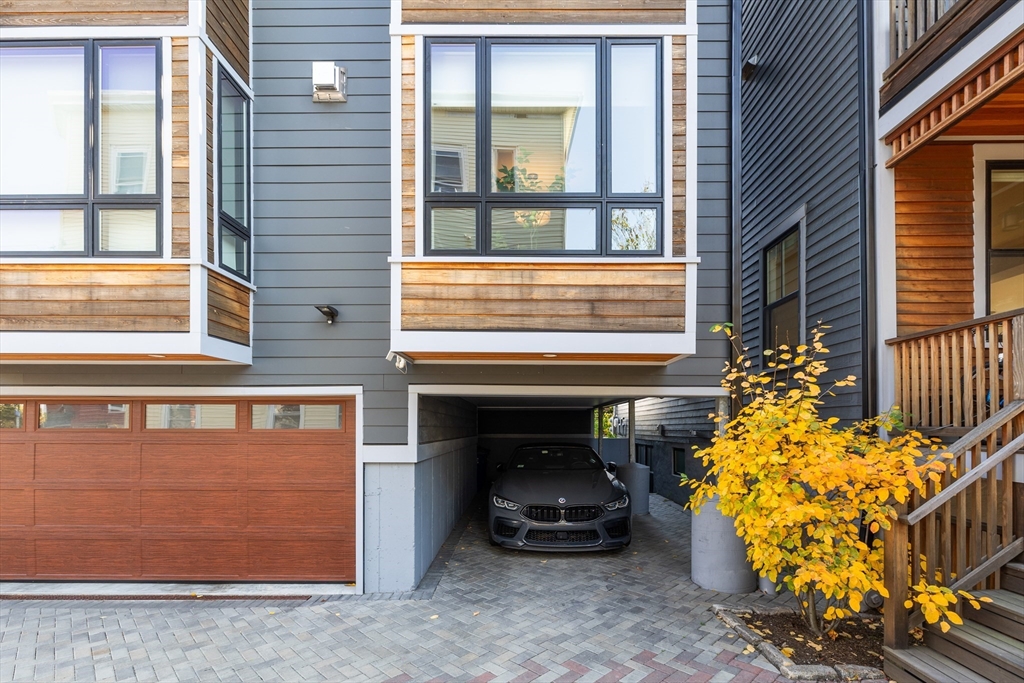 2 Village Street, Unit 2 Somerville, MA 02143 - Photo 17 of 18 a car parked in front of a building