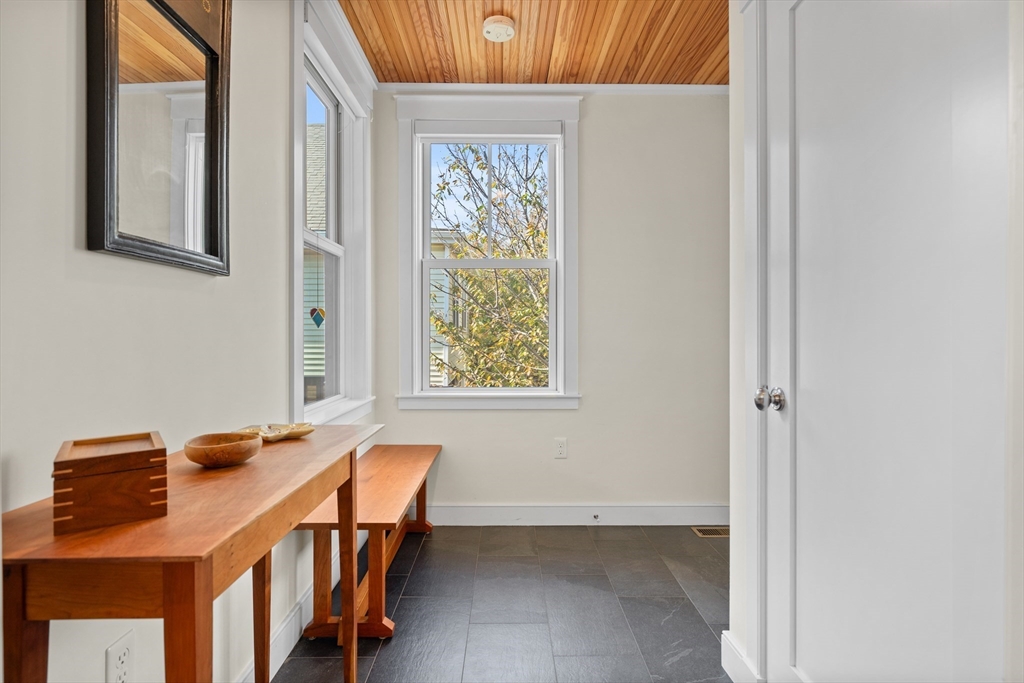 2 Village Street, Unit 2 Somerville, MA 02143 - Photo 7 of 18 a balcony with table and chairs