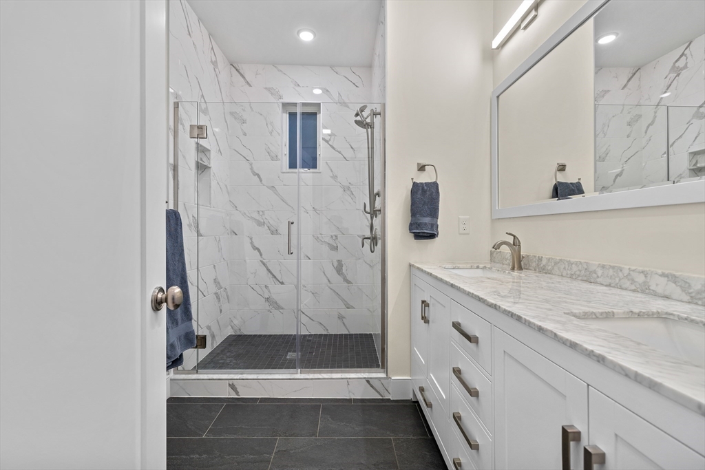 2 Village Street, Unit 2 Somerville, MA 02143 - Photo 10 of 18 a bathroom with a sink a toilet and shower