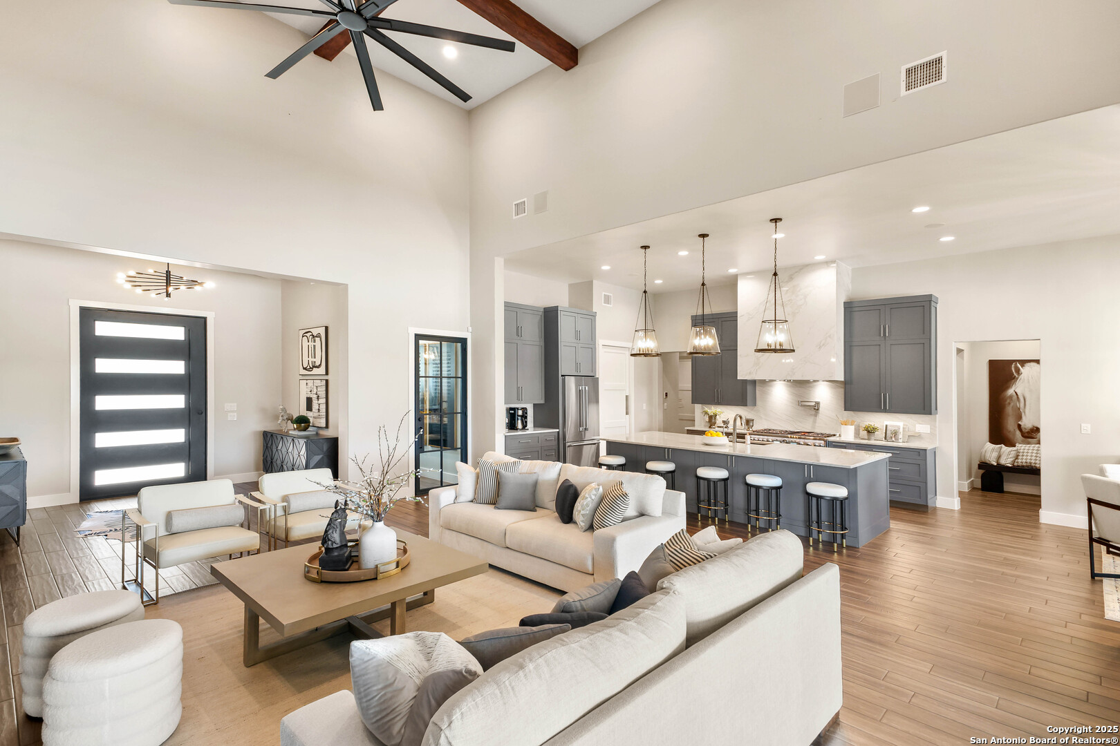 596 Ruger Road Fredericksburg, TX 78624 - Photo 11 of 63 a living room with furniture kitchen view and a wooden floor