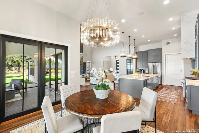 a large kitchen with a table and chairs