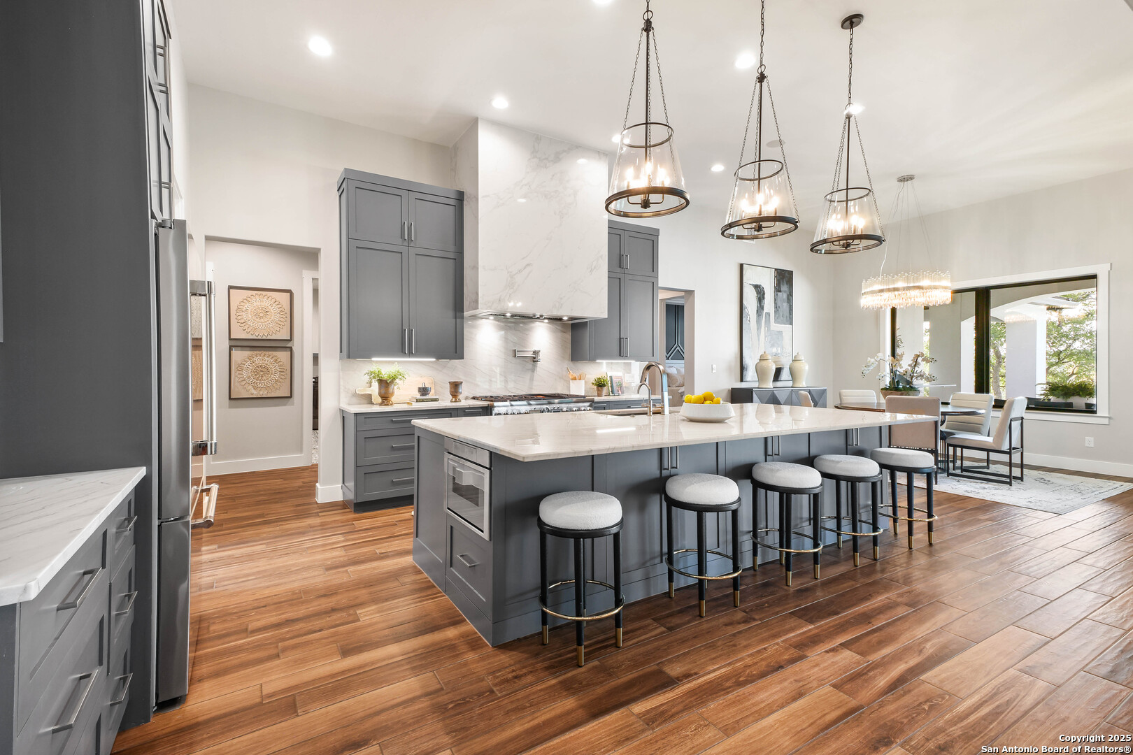596 Ruger Road Fredericksburg, TX 78624 - Photo 16 of 63 a large kitchen with a table and chairs