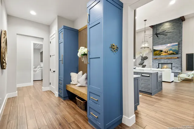a white tub sitting in a bathroom next to a window
