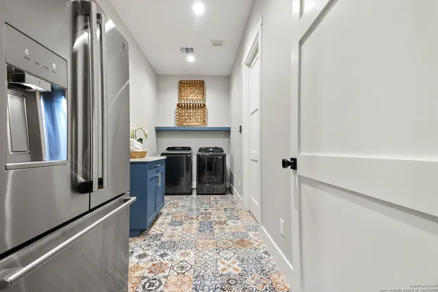 a bed room with a bed mirror and a window