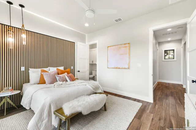 a bedroom with a large bed and a window