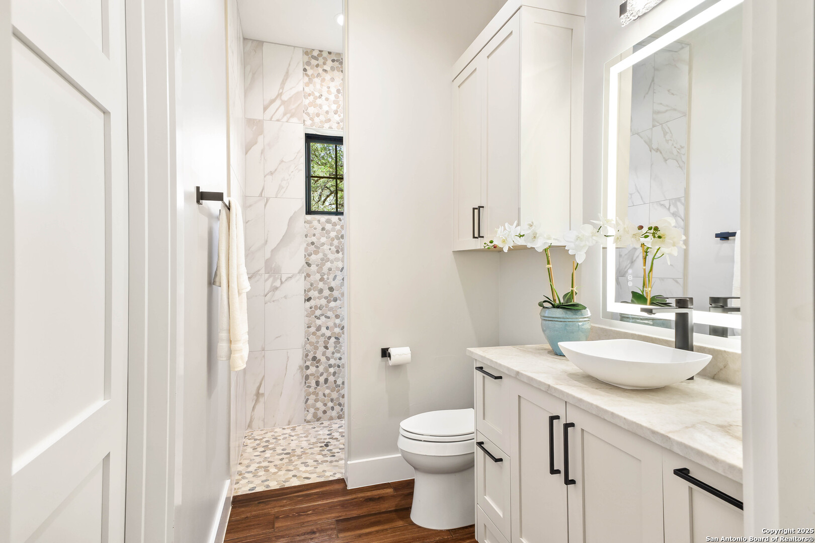 596 Ruger Road Fredericksburg, TX 78624 - Photo 30 of 63 a bathroom with a granite countertop sink toilet and shower