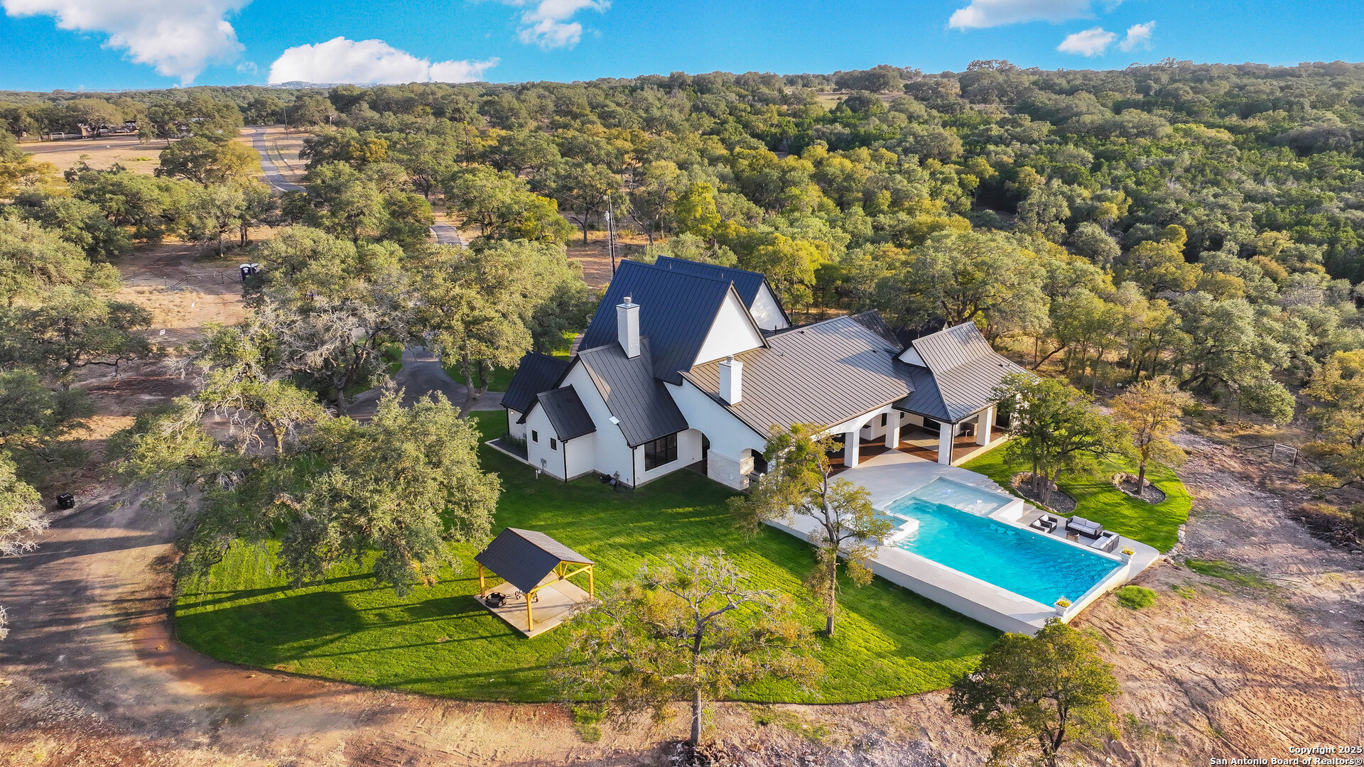 596 Ruger Road Fredericksburg, TX 78624 - Photo 3 of 63 an aerial view of a house