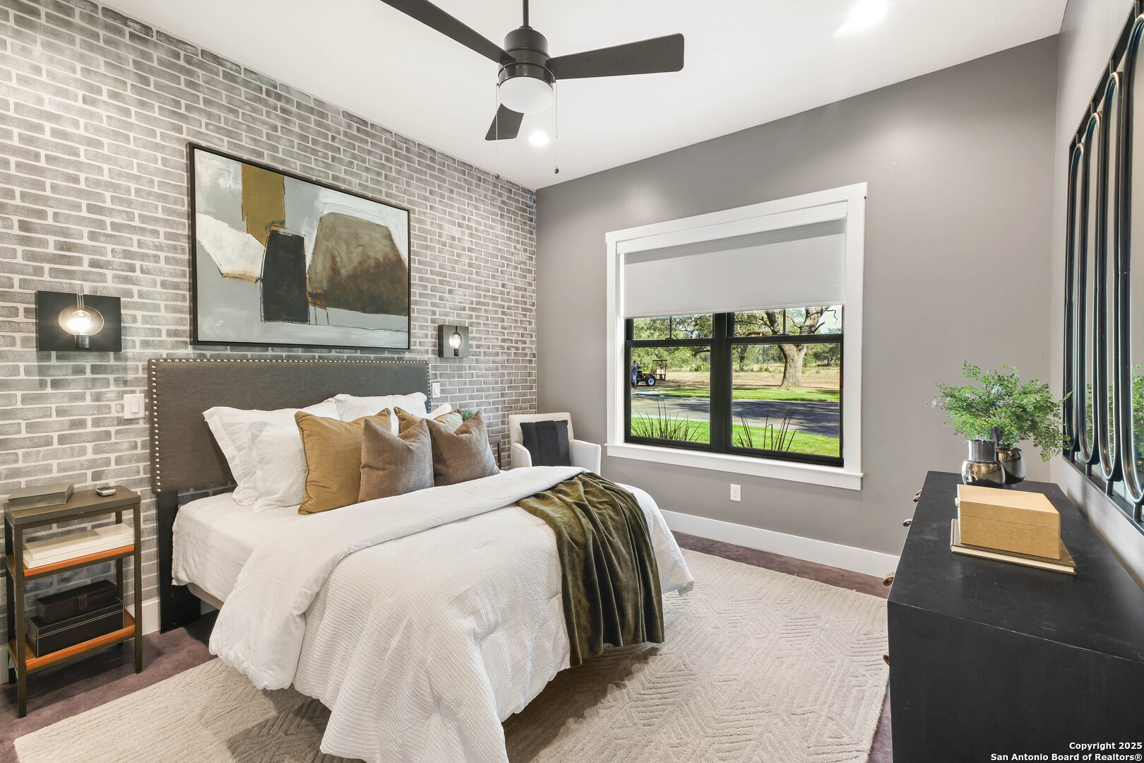 596 Ruger Road Fredericksburg, TX 78624 - Photo 31 of 63 a bed room with a bed mirror and a window