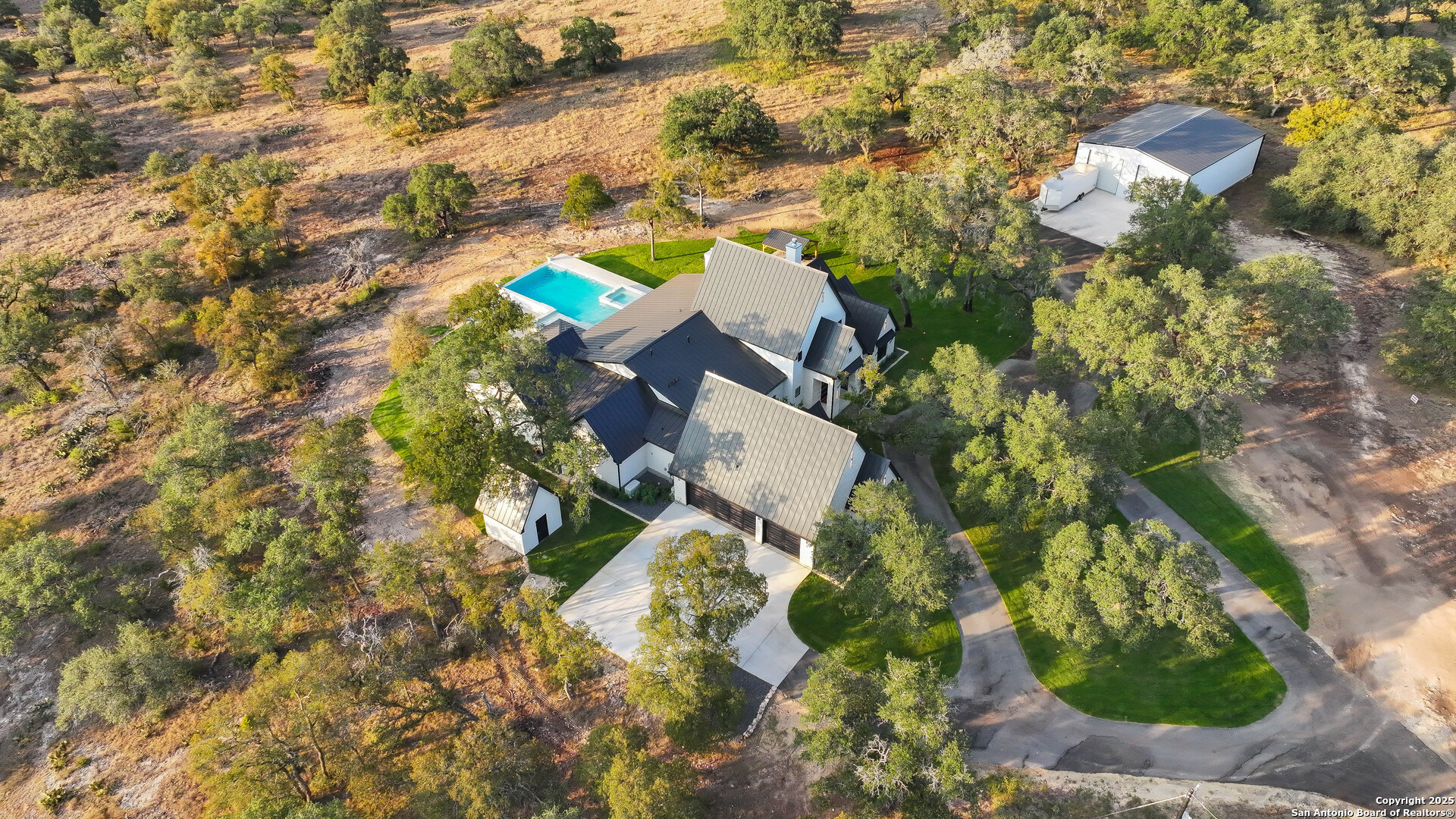 596 Ruger Road Fredericksburg, TX 78624 - Photo 41 of 63 an aerial view of residential house with parking and yard