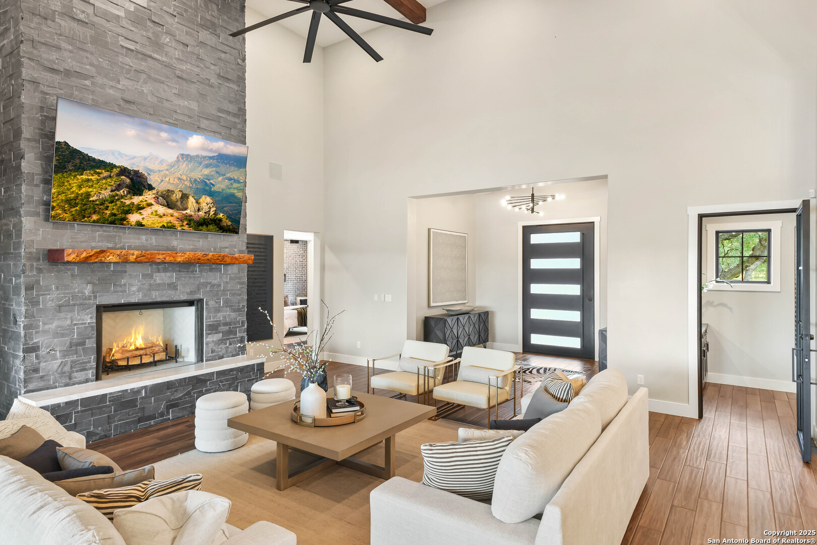 596 Ruger Road Fredericksburg, TX 78624 - Photo 7 of 63 a living room with furniture and a fireplace